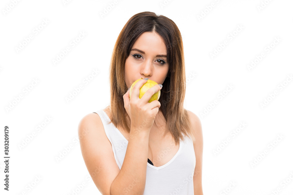 Young woman over isolated white background with an apple Young woman over isolated white background with an apple