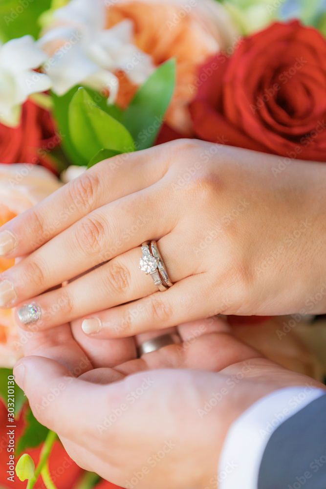 Fototapeta premium Wedding couple hands with rings
