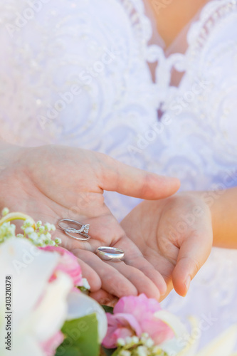 wedding couple holding rings