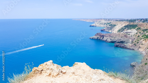 Beautiful azure sea and rocky cliffs. sea sky cliff