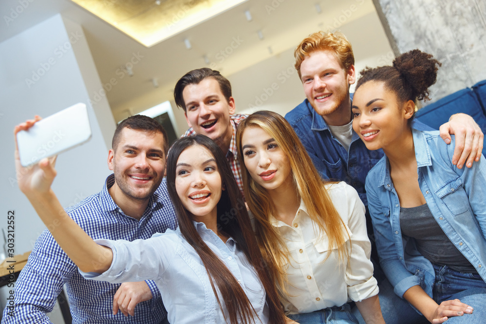 Fototapeta premium Group of friends having party indoors fun together moment for photo
