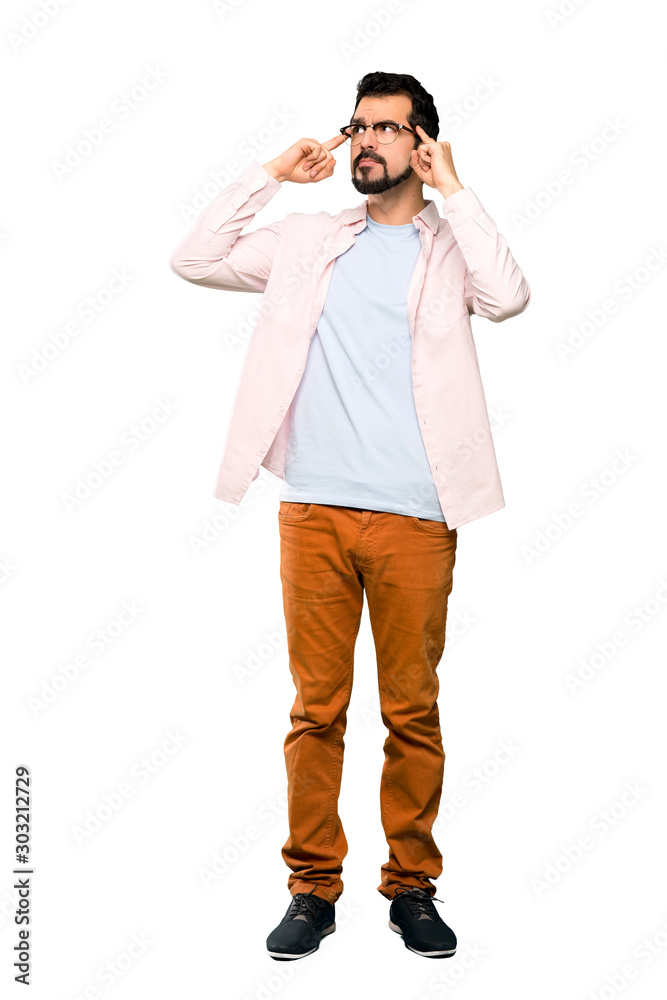 Full-length shot of Handsome man with beard having doubts and thinking over isolated white background Full-length shot of Handsome man with beard having doubts and thinking over isolated white background