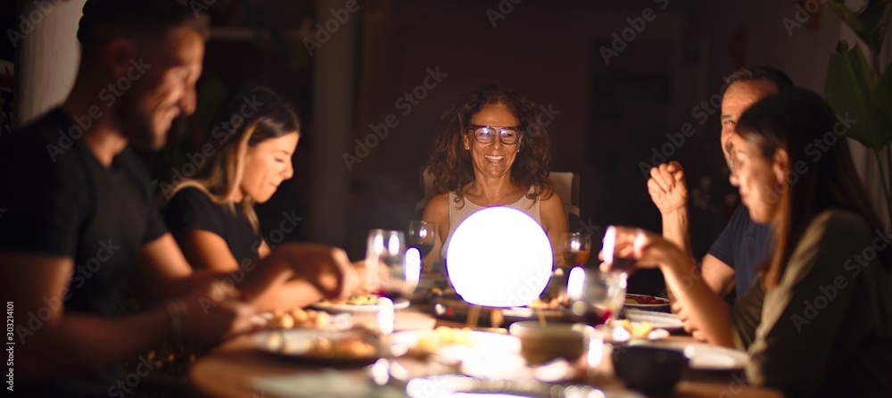 Beautiful family on dinner talking and smiling at terrace Beautiful family on dinner talking and smiling at terrace