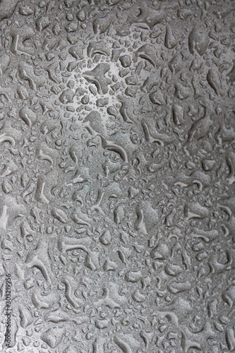 texture of water drops. background of water on a background of a silver surface.
