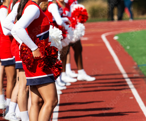 Cheerleaders on the track during a football game