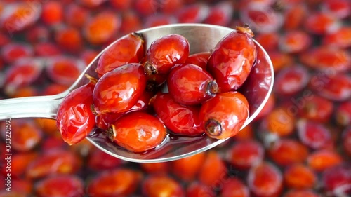 Wash the rosehip fruits in water and mix with spoon,
