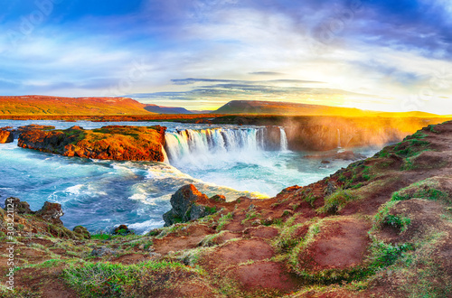 Fantastic sunrise scene of powerful Godafoss waterfall.