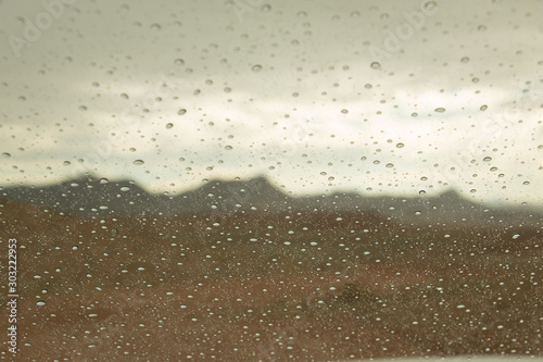 rain drops on car window in the desert of Namibia 