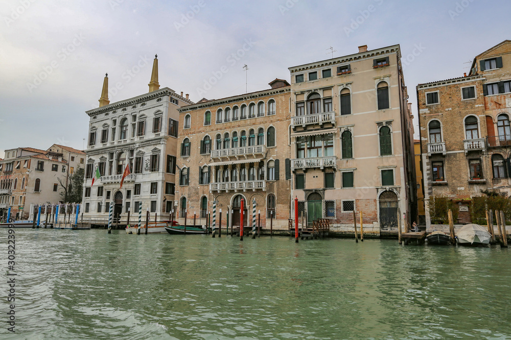 Fototapeta premium The colorful landscape of a historic city on the water. Venice, Italy