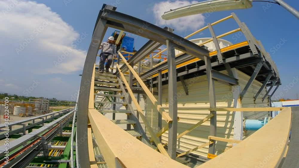 A worker wearing personal protection equipment and safety helmet to working in petroleum refinery plant A worker wearing personal protection equipment and safety helmet to working in petroleum refinery plant