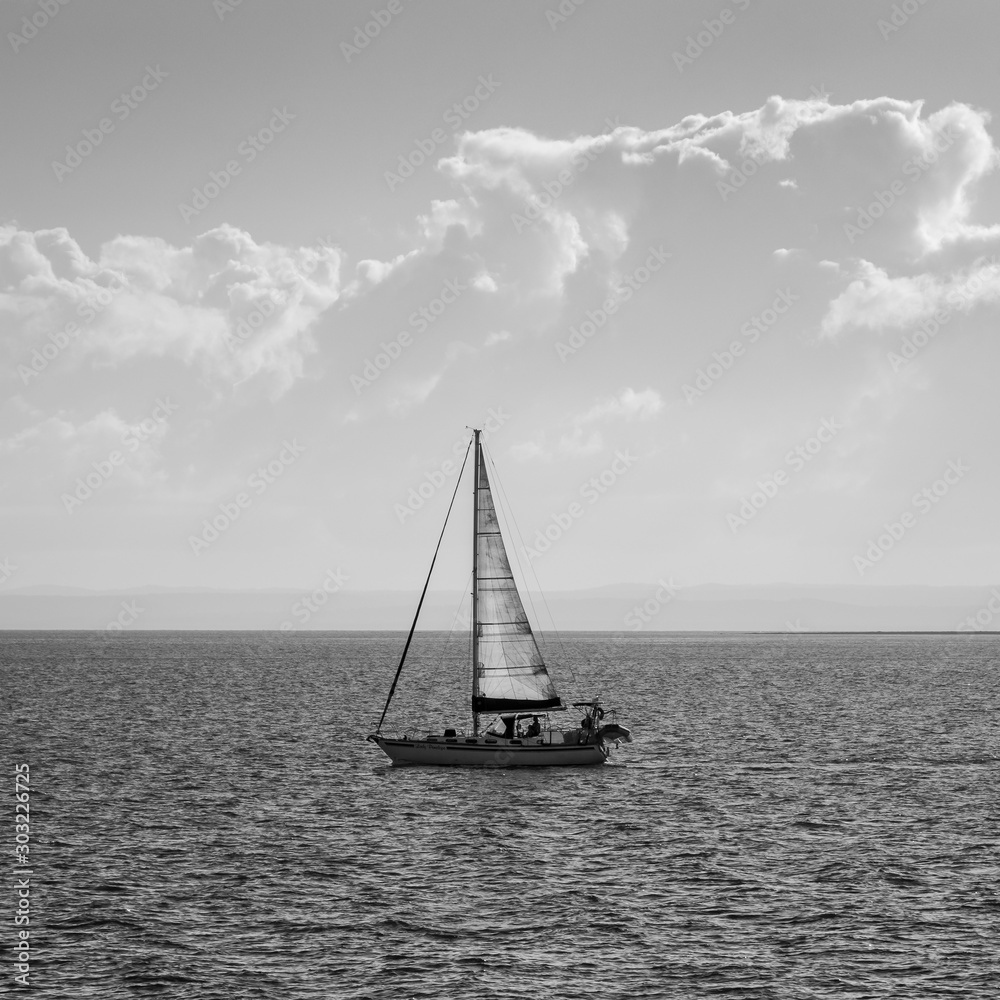 sailboat on the sea black and white