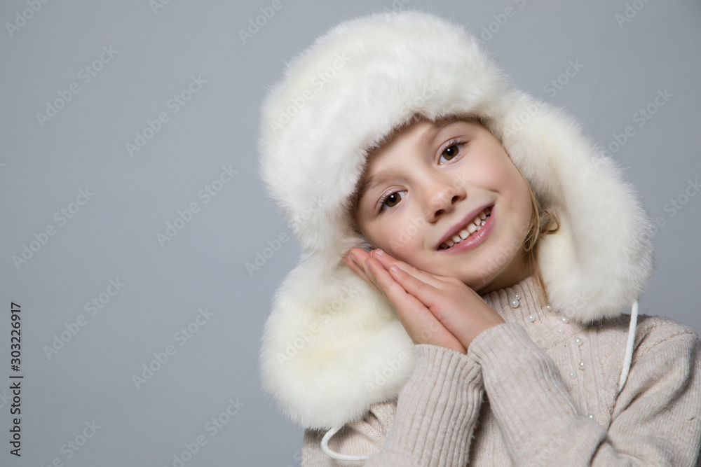 Smiling girl in the winter look, christmas concept. Smiling girl in the winter look, christmas concept.