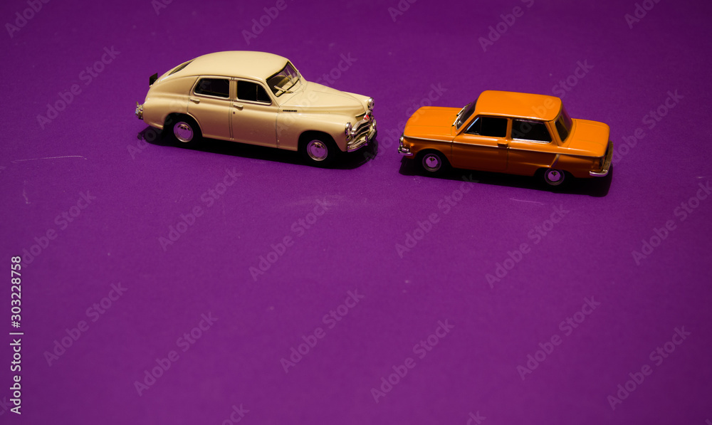 Vintage toycars on purple background