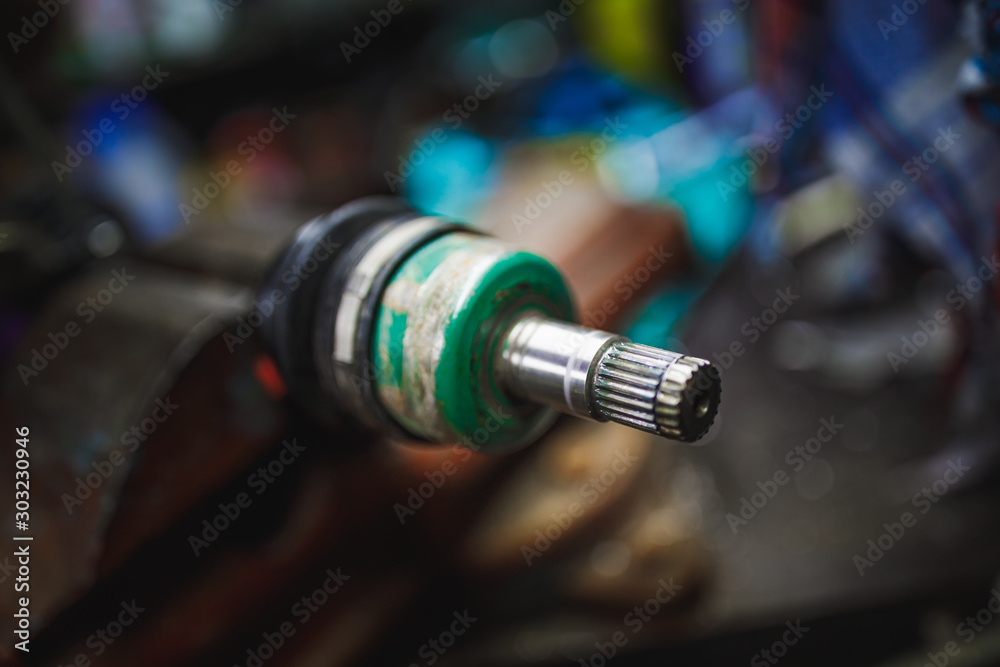 ATV constant-velocity CV joint repair in old garage ATV constant-velocity CV joint repair in old garage
