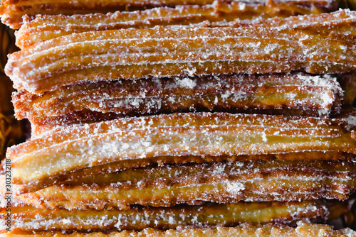 Fényképezés Macro photograph of churros covered up with sugar