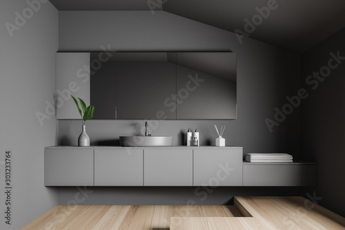 Gray bathroom interior with sink and mirror