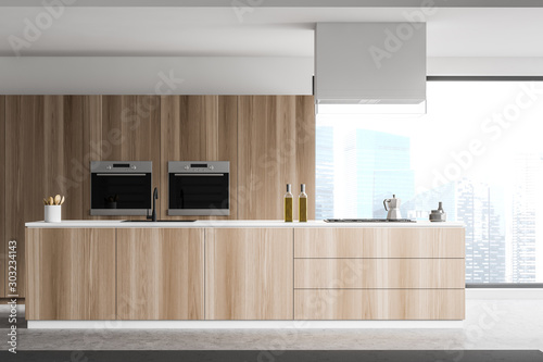 Close up of island in panoramic wooden kitchen