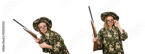 The girl in military uniform holding the gun isolated on white