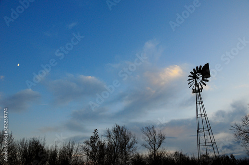 Rural Windmill at Sunset with Moon