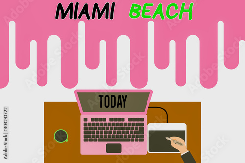 Handwriting text writing Miami Beach. Conceptual photo the coastal resort city in MiamiDade County of Florida Upper view laptop wooden desk worker drawing tablet coffee cup office photo