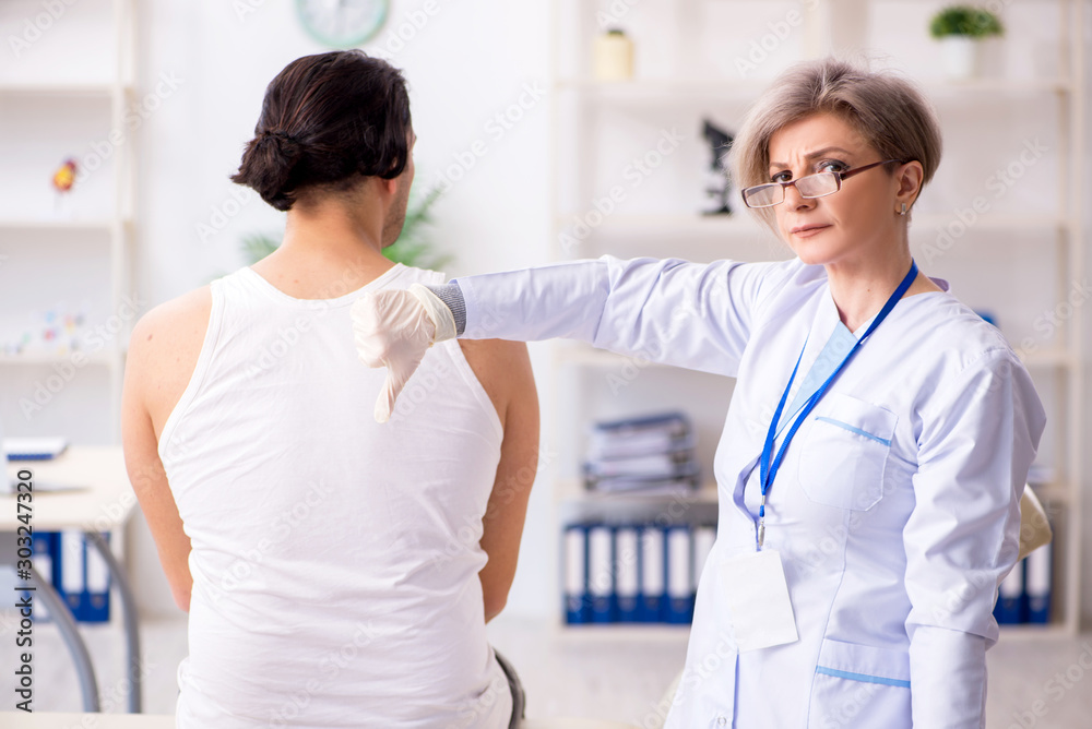 Young patient visiting doctor in hospital Young patient visiting doctor in hospital