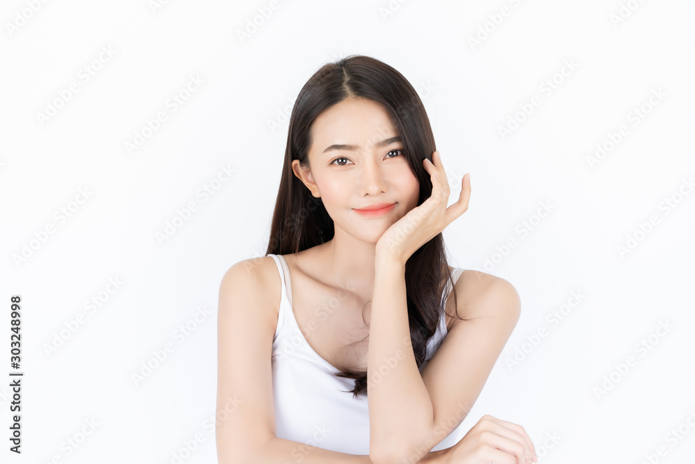 Young asian woman has smiling face and bright skin tone.Asian woman standing with isolated white background. Young asian woman has smiling face and bright skin tone.Asian woman standing with isolated white background.