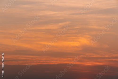 Beautiful orange sky on sunset background. Image. © nattaphol
