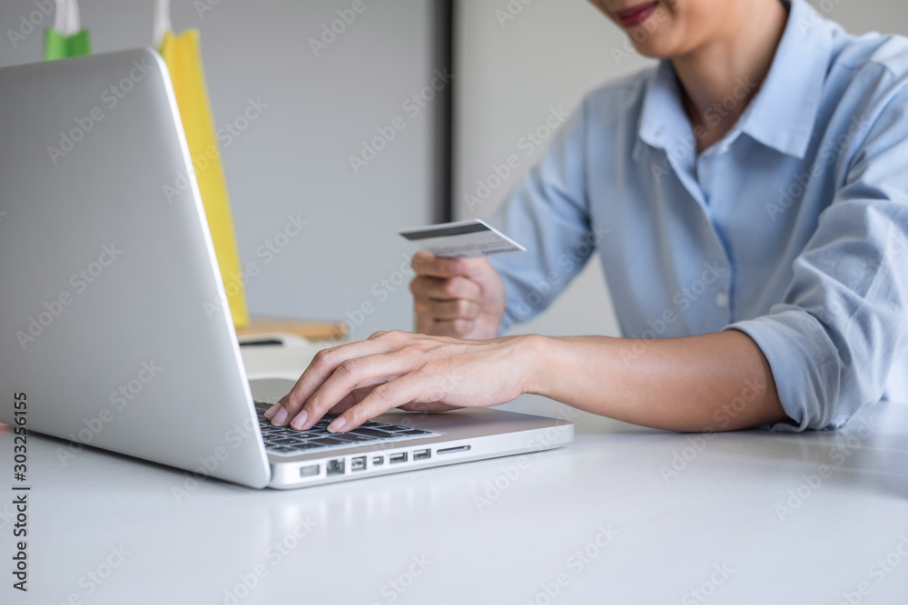 Woman using credit card register security code payments online shopping and customer service network connection market, using technology on laptop, Internet Online shopping or banking concept