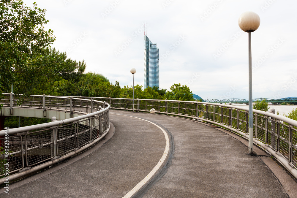 Raised spiral pedestrian and bicycle pathway beside Danube River, Vienna, Austria