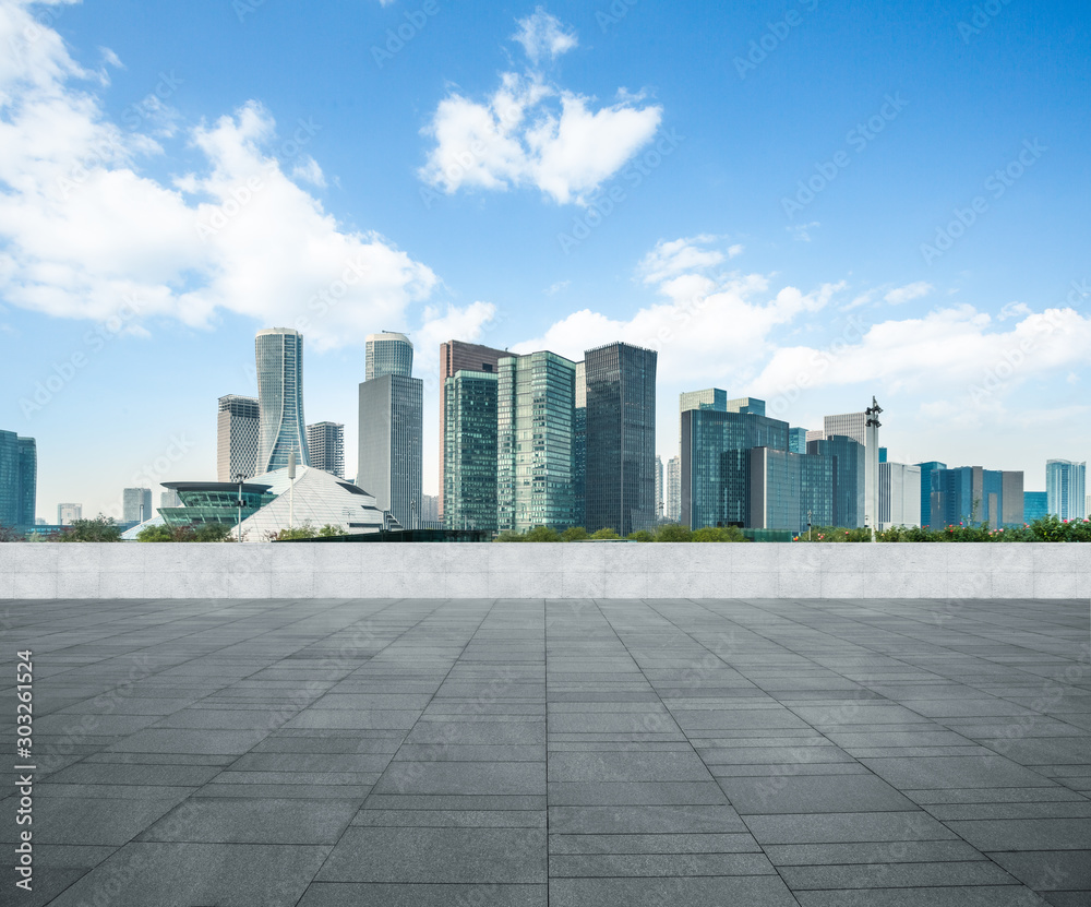 Panoramic skyline and buildings with empty square floor.