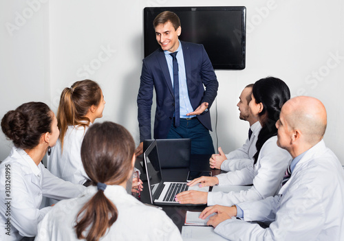 Manager making speech during business meeting