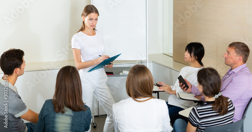 Woman presenting business project to partners