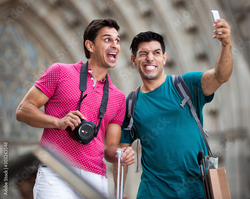 Men making selfie near sights in Barcelona photo