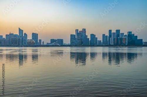 City Skyline By River Against Sky at twilight. © hallojulie