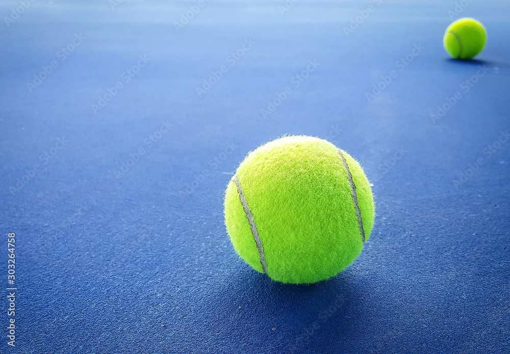 Close-up shots of tennis balls on a blue background field