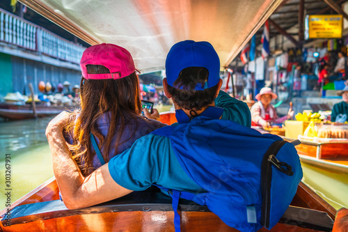Photography Couple traveler on boat joy fun Damnoen Saduak floating market, Most popular fam