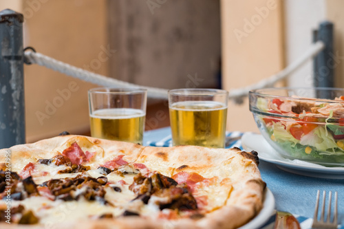 Delicious italian pizza and beer