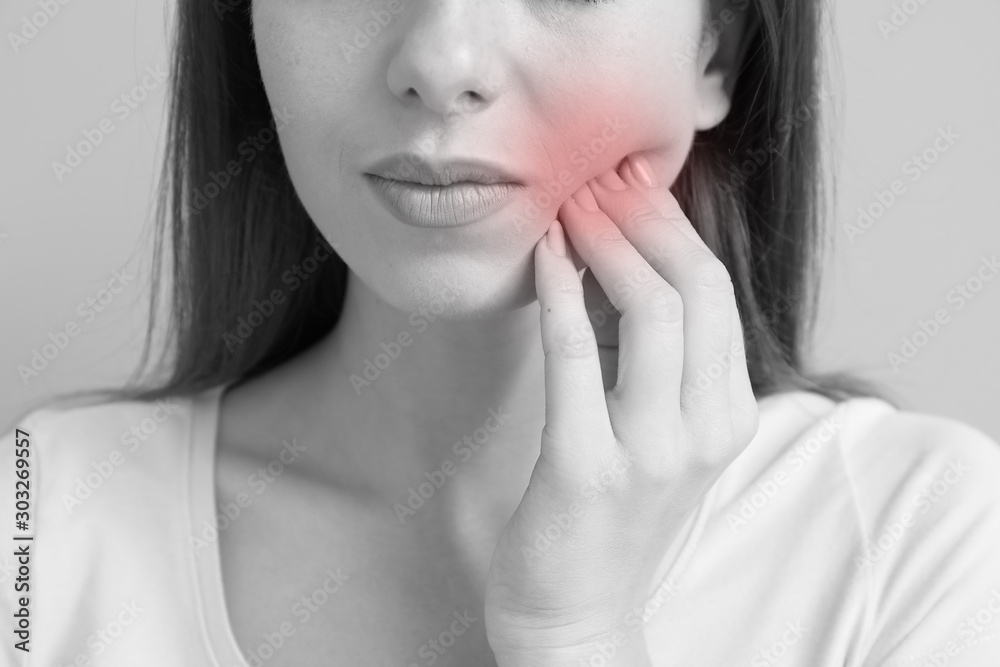 Young woman suffering from toothache, closeup Young woman suffering from toothache, closeup