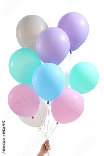Female hand with balloons on white background