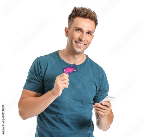 Young man with credit card ...