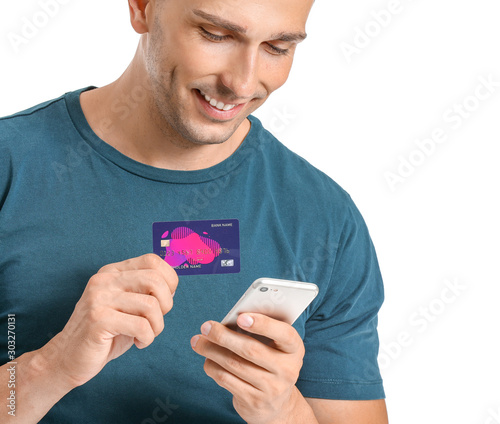 Young man with credit card ...