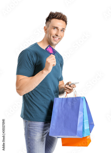 Young man with credit card,...