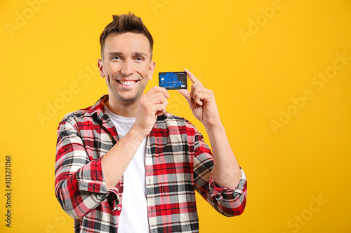 Young man with credit card ...