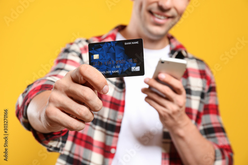 Young man with credit card ...