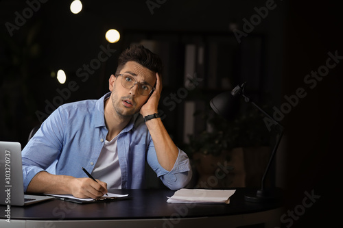 Tired man trying to meet de...