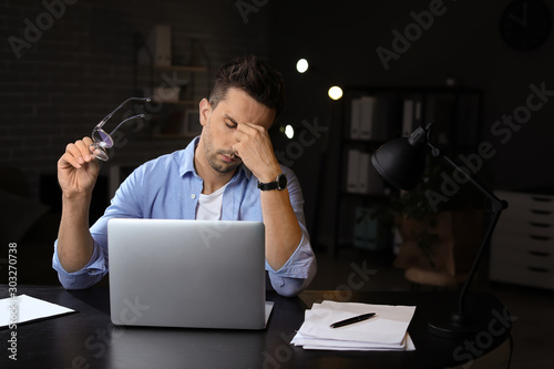 Tired man trying to meet de...