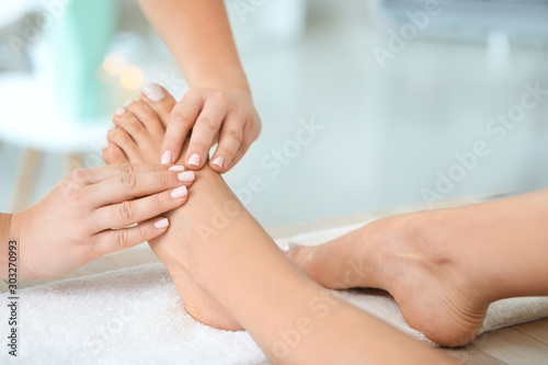 Beautiful young woman receiving foot massage in spa salon © Pixel-Shot