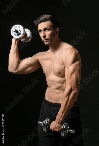 Muscular Man Working Out wi...