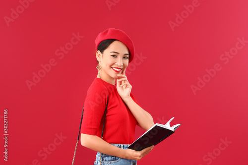 Fashionable Asian woman wit...