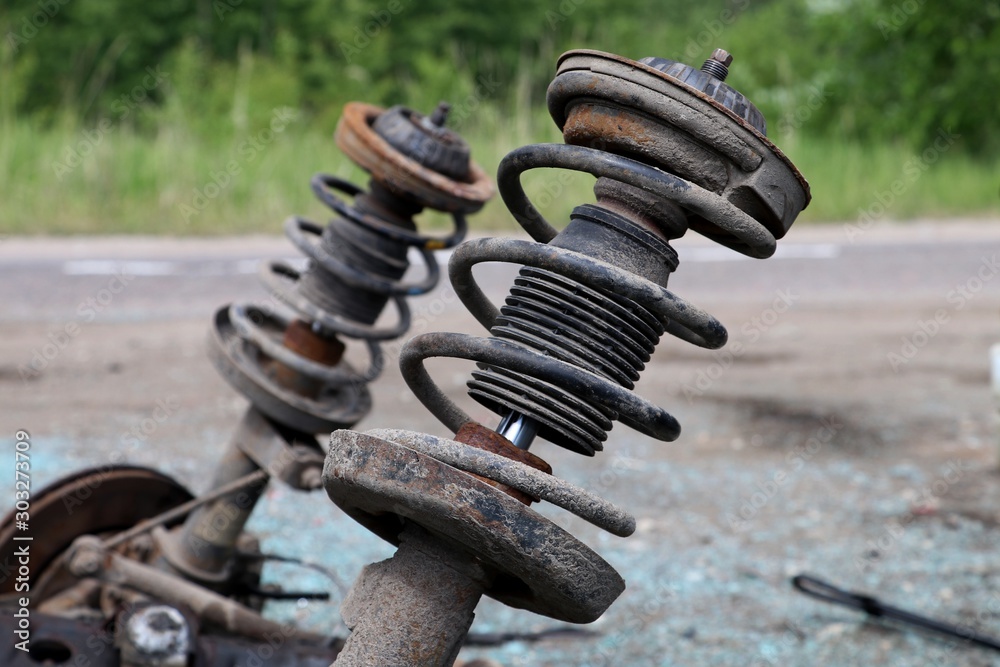 Old shock absorber with spring